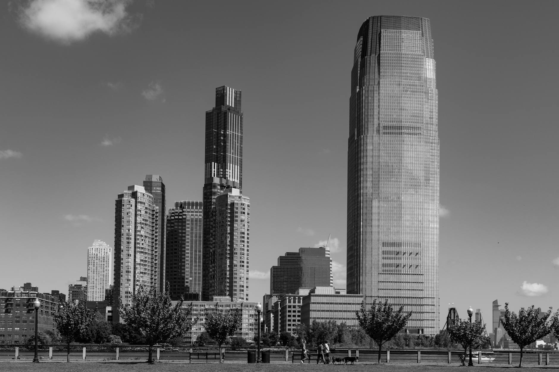 Dramatic black and white photo of Jersey City's distinctive skyline on a clear day.